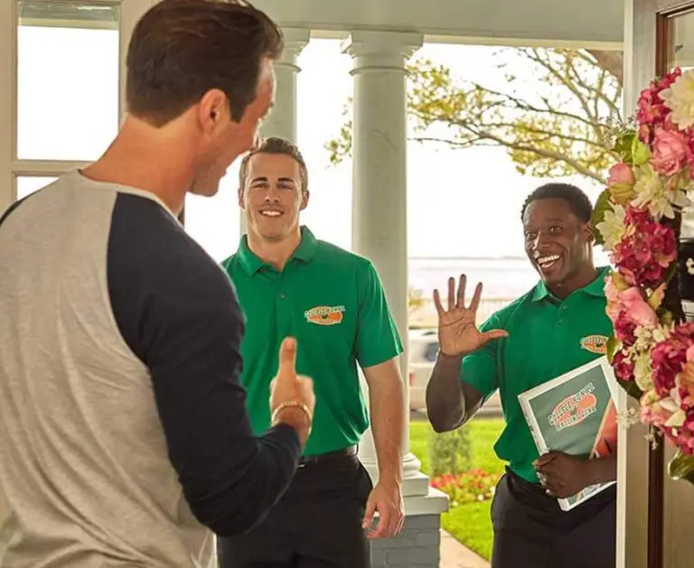 College HUNKS crew with a satisfied customer, the veteran-friendly business a franchise loan can fund