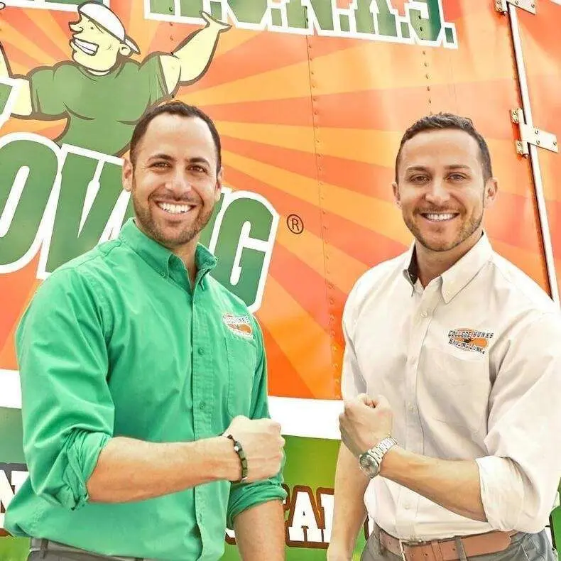 College HUNKS founders Omar Soliman and Nick Friedman in front of a College HUNKS truck
