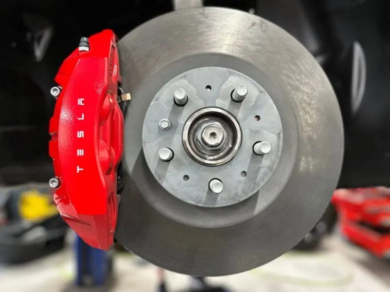 Why do my Tesla brakes squeak?