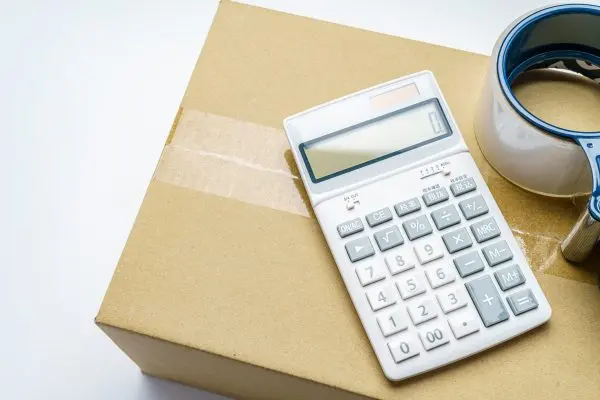 Calculator sitting on top of a cardboard box