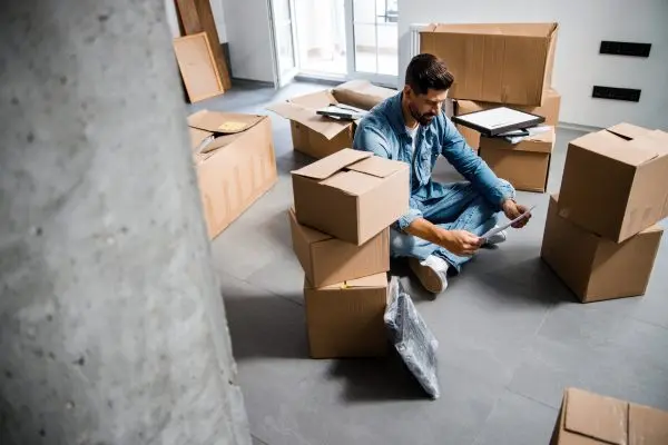 Homeowner packing boxes