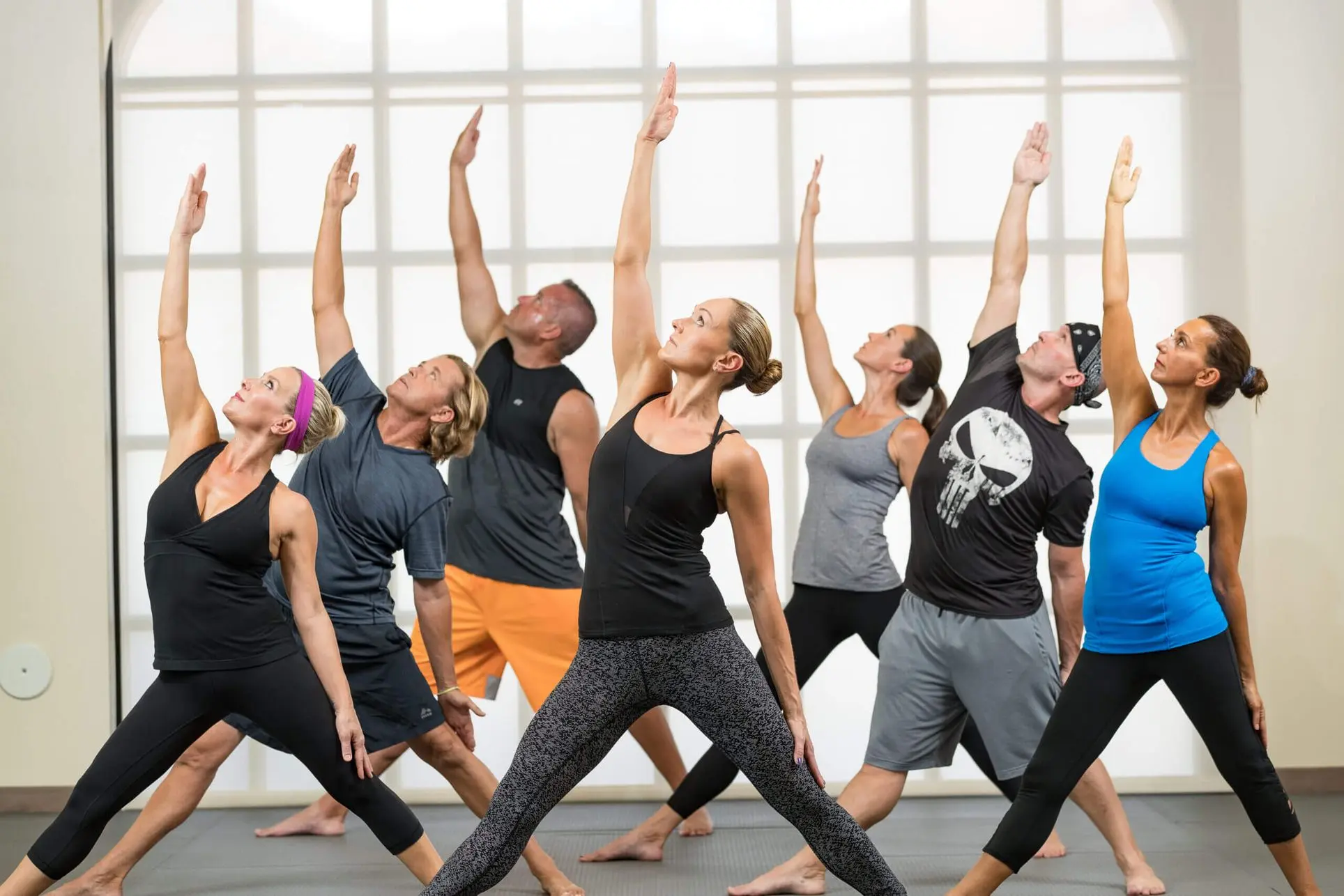 Group of adults practicing yoga