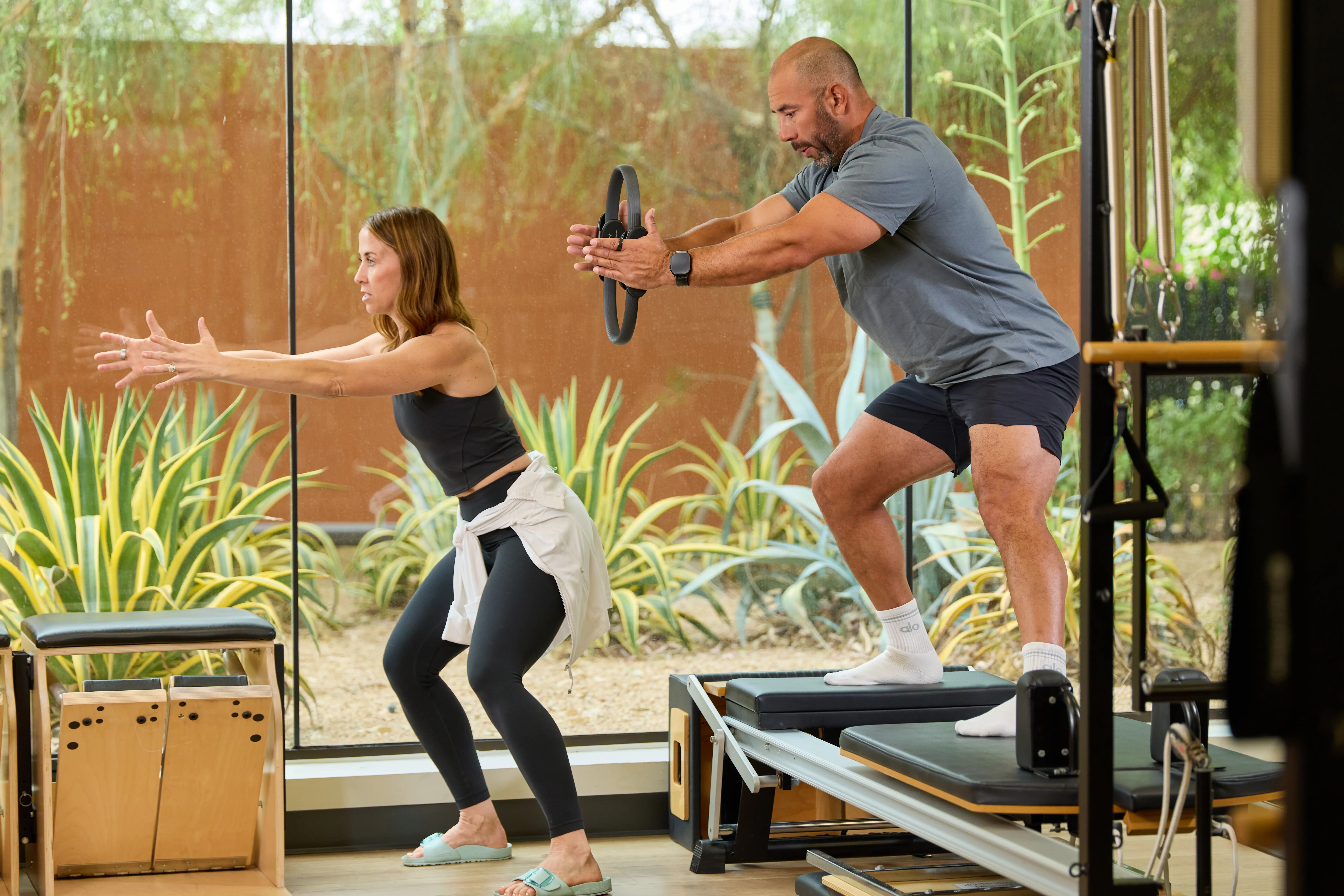 Village Man and Woman Working out holding weights