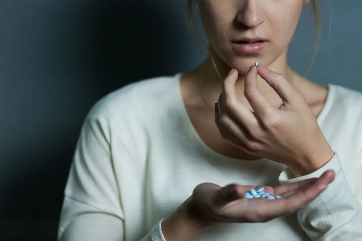 dynamic-health-slide-cropped4 - Dynamic Health Carolinas depressed girl taking a handful of pills