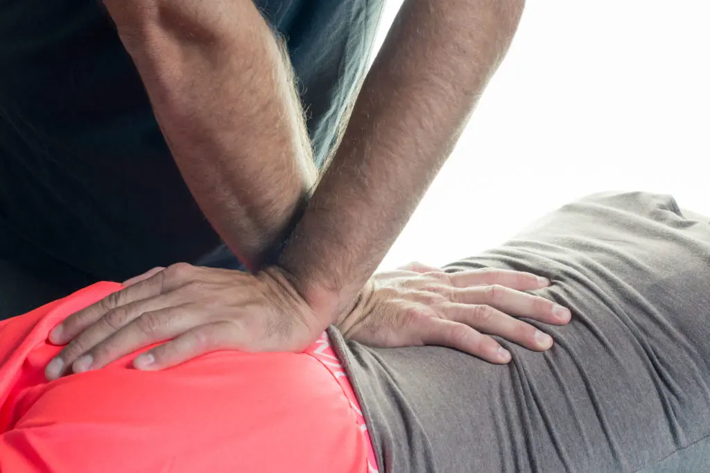 Chiropractic adjustment on an athlete's back