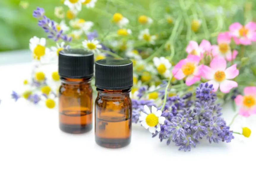 42098996 - essential oils with herbal flowers - Dynamic Health Carolinas essential oils with herbal flowers