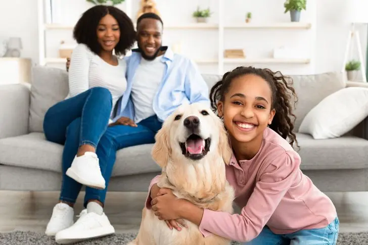 Young black girl hugging with dog posing at home | BritLin Cleaning House Cleaning Round Rock TX