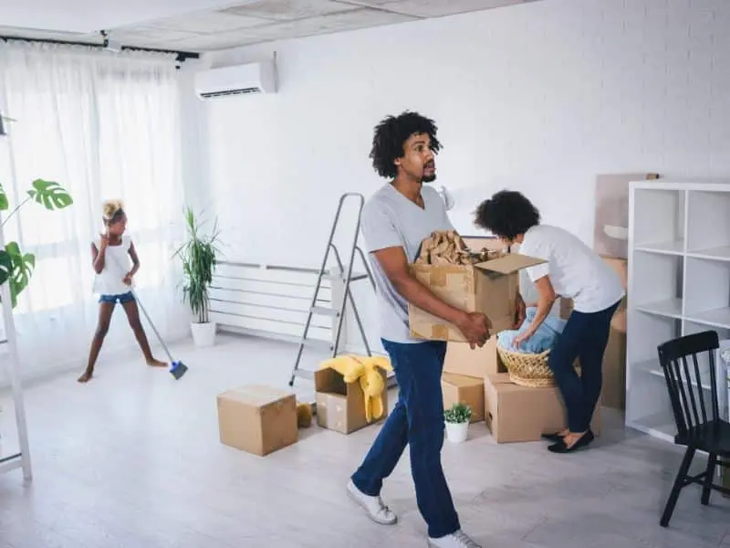 Family of three in the process of moving out