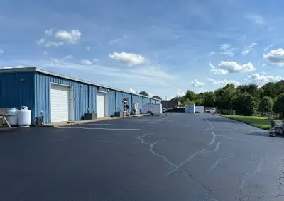 Commercial warehouse parking lot with repaired asphalt cracks