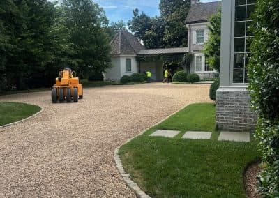 Driveway grading and preparation at a residential property