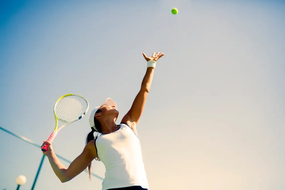 Beautiful female tennis player serving Beautiful female tennis player serving