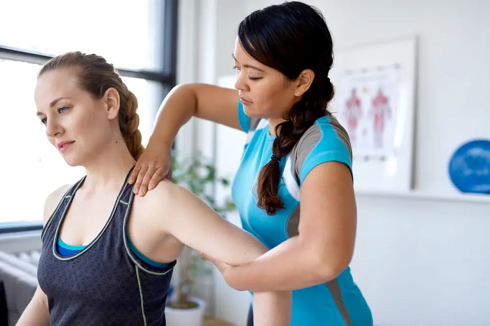 PT working with a patient PT working with a patient