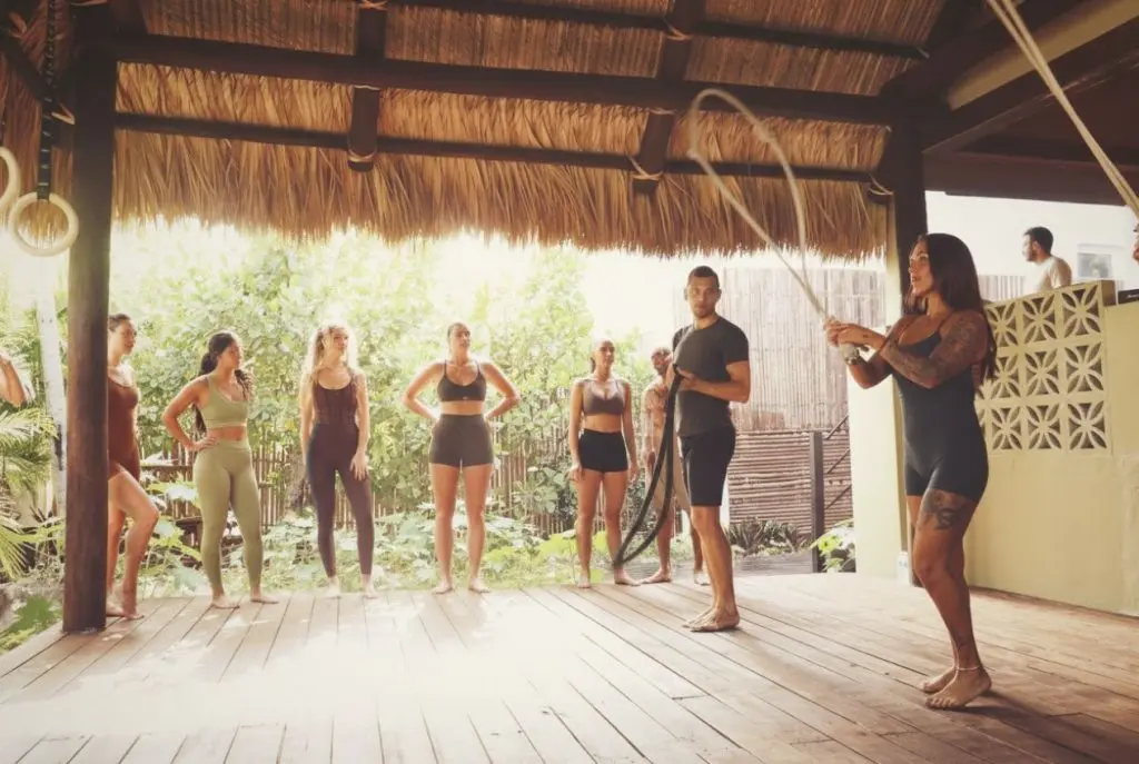 Group fitness training with battle ropes at SILA Miami, a third space fitness and longevity community in Miami, FL