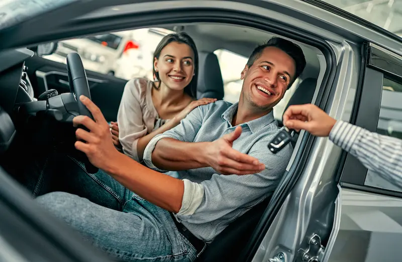 At a car dealership, buying a car
