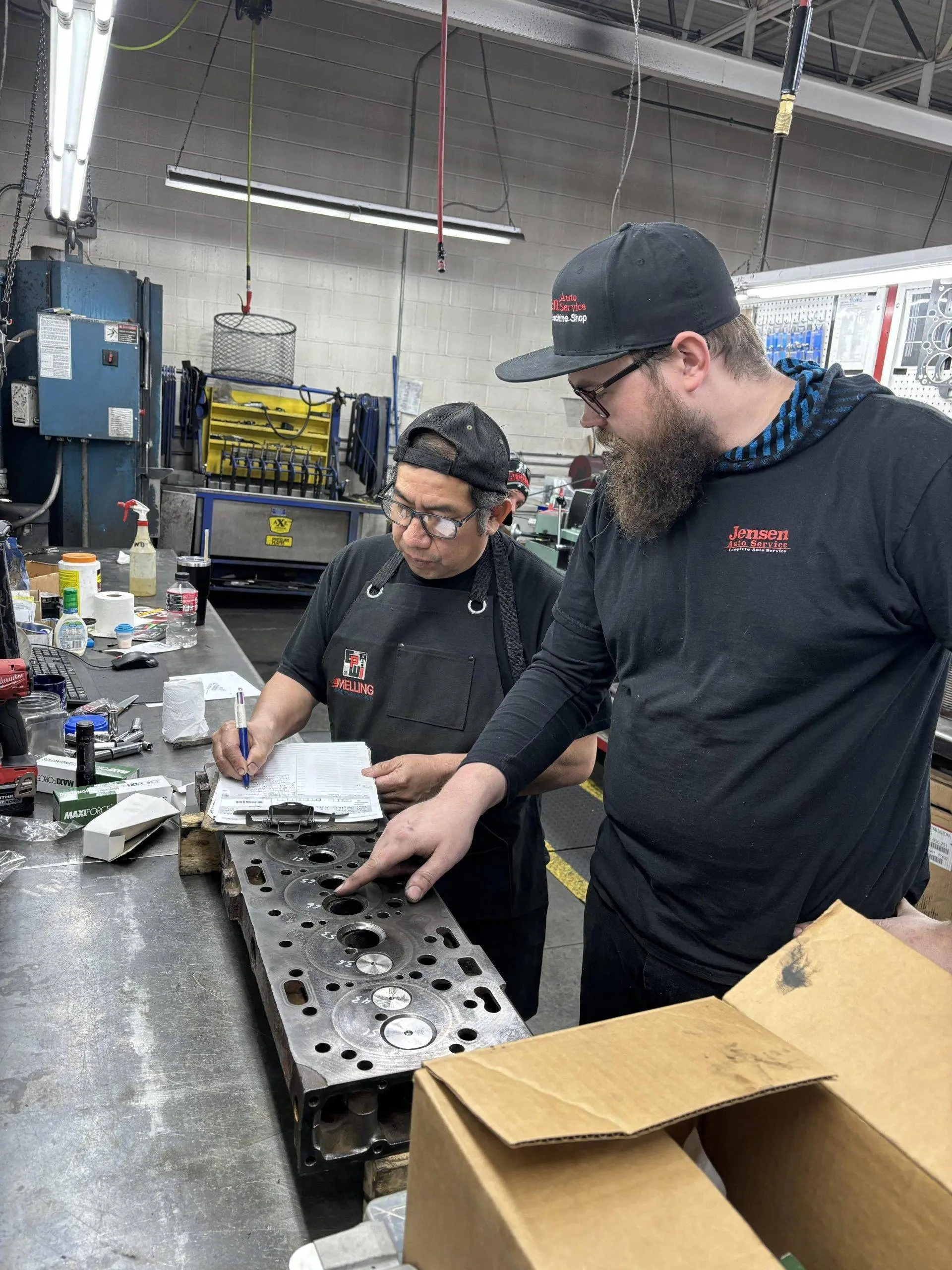 two of Jensen's mechanic working