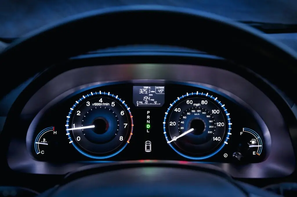 Tachometer, car dashboard,instrument panel,and fuel gauge. A speedometer