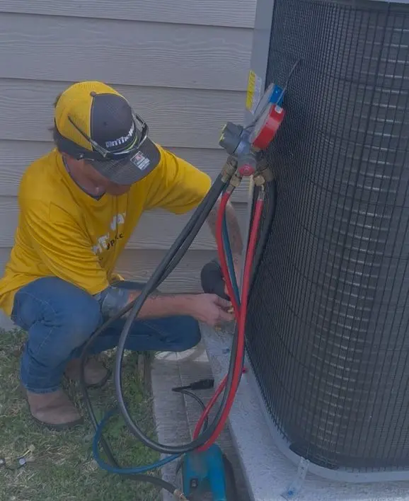 AC repair technician servicing condenser in Texas City TX