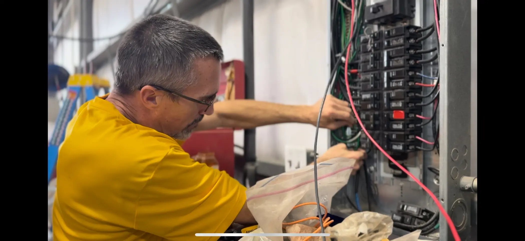 Electrician working on panel upgrade in Texas City TX