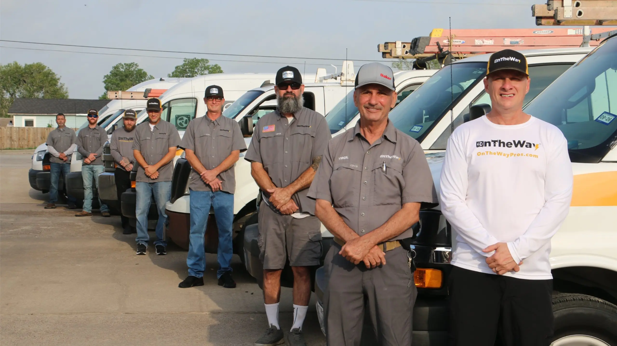 On The Way full team of technicians standing in front of their fleet