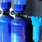 Blue water filtration tanks and filter system for improving home water quality by B&L Plumbing.