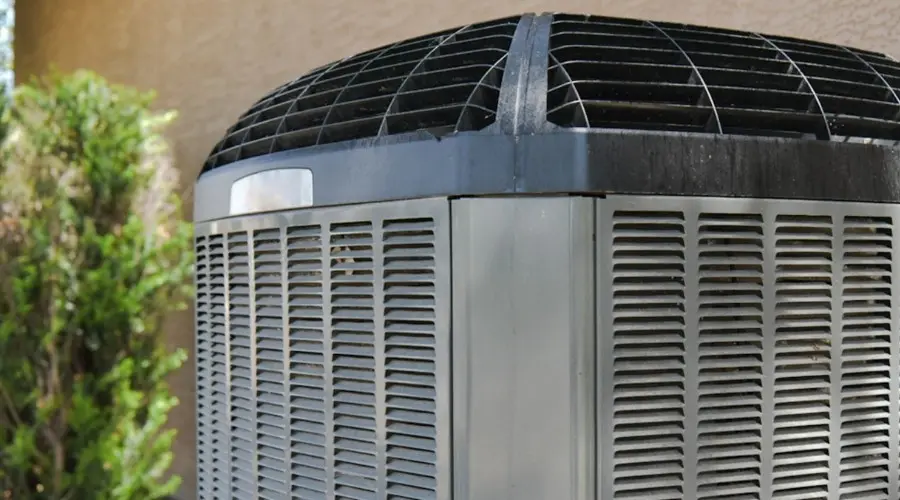 Air conditioning unit outdoors, highlighting maintenance importance for efficiency and reliability in HVAC systems.