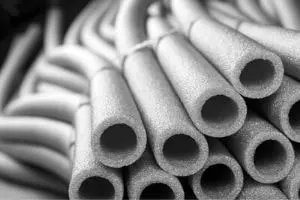 Foam insulation sleeves for pipes, emphasizing protection against freezing temperatures, relevant to plumbing maintenance and pipe insulation solutions.