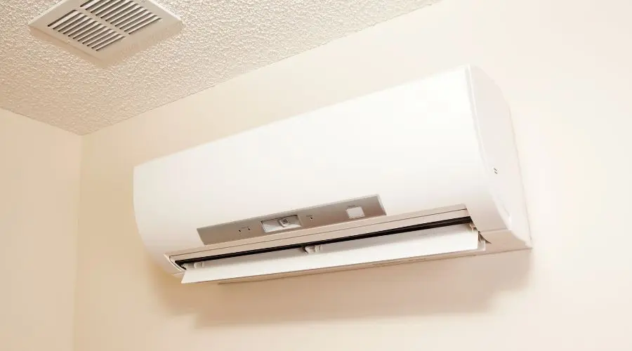 Sleek wall-mounted air conditioning unit with control panel, provided by B&L Plumbing for efficient climate control.