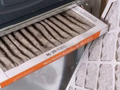 Air filter showing micro particle reduction specifications, emphasizing energy efficiency in HVAC systems for fall maintenance.