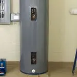Gray water heater in utility area with control panel, ideal for plumbing service related to maintenance and installation.