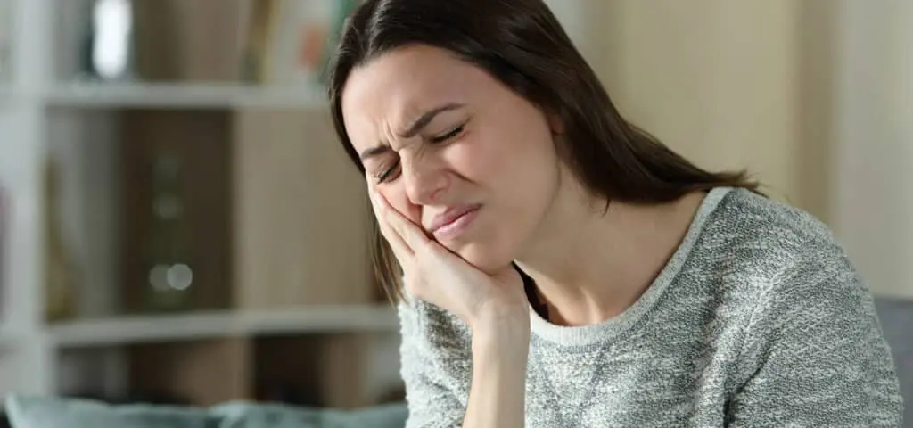 woman with tooth pain