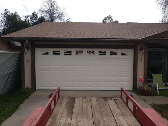Flawlessly operating garage door after comprehensive spring repair by local experts in visalia