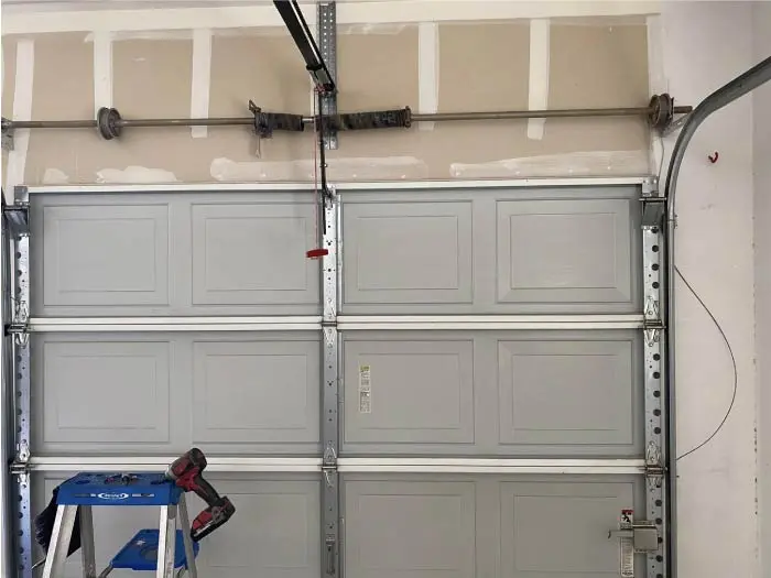 garage-door-visalia seamless functionality achieved through a complete garage door track repair.
