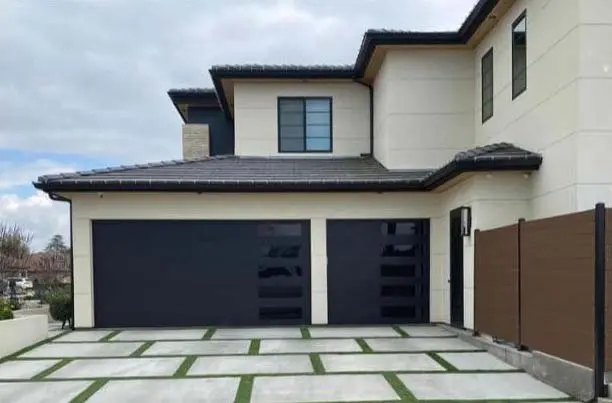 modern-garage-door Residential garage doors receiving thorough professional inspection for optimal performance.