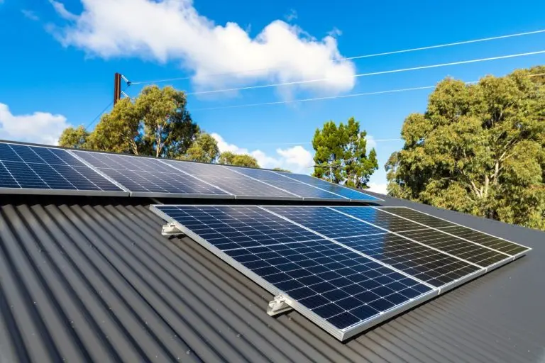 New solar panels installed on metal sheet roof of the house