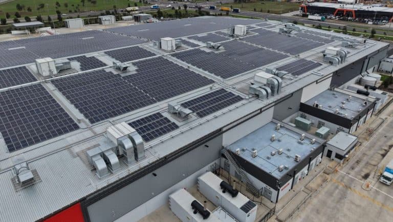 Industrial building rooftops with solar panels generating renewable energy