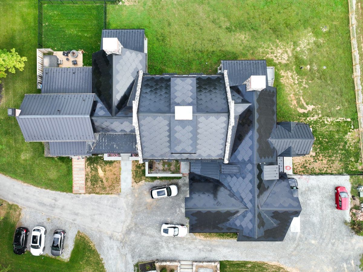 Aerial view of a large house with solar panels