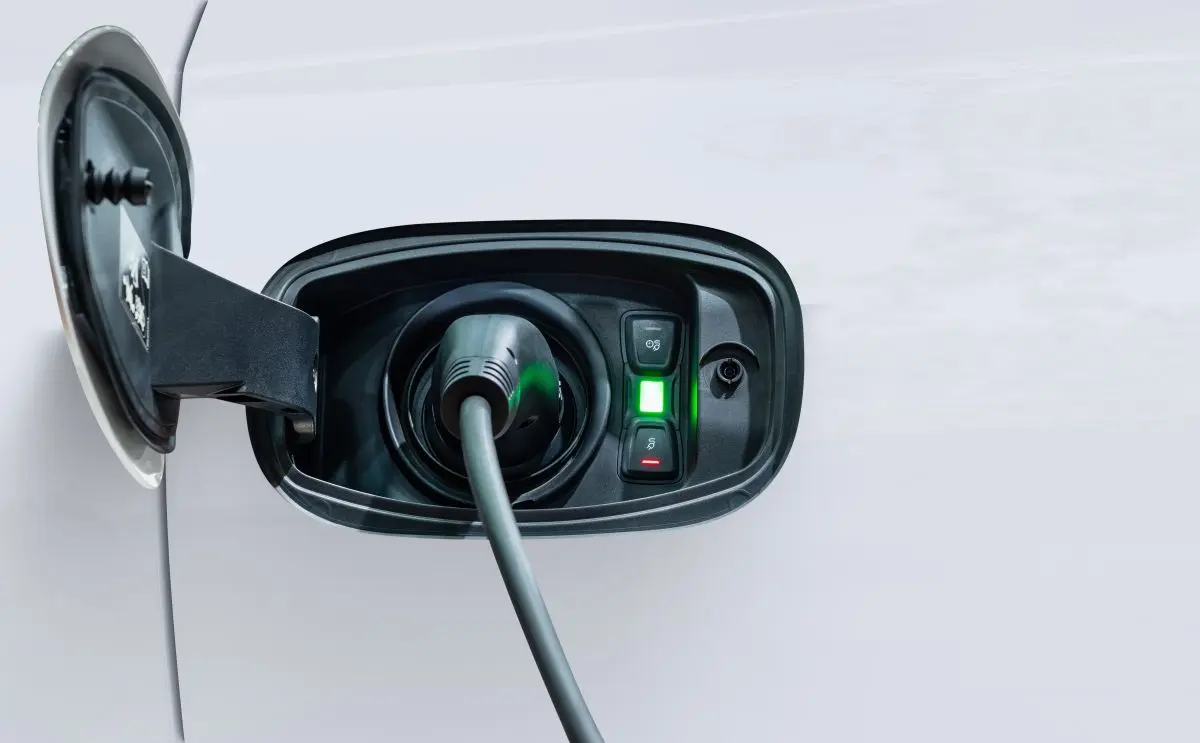 White electric car charging with copy space, Technology electric vehicle concept
