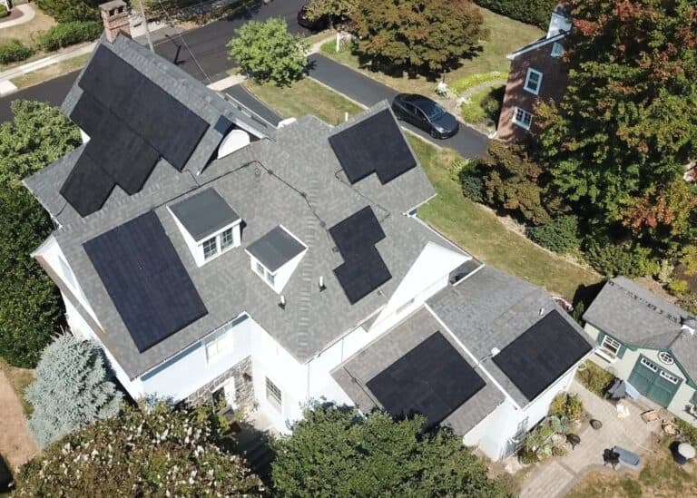 Large house with several solar panels on the roof
