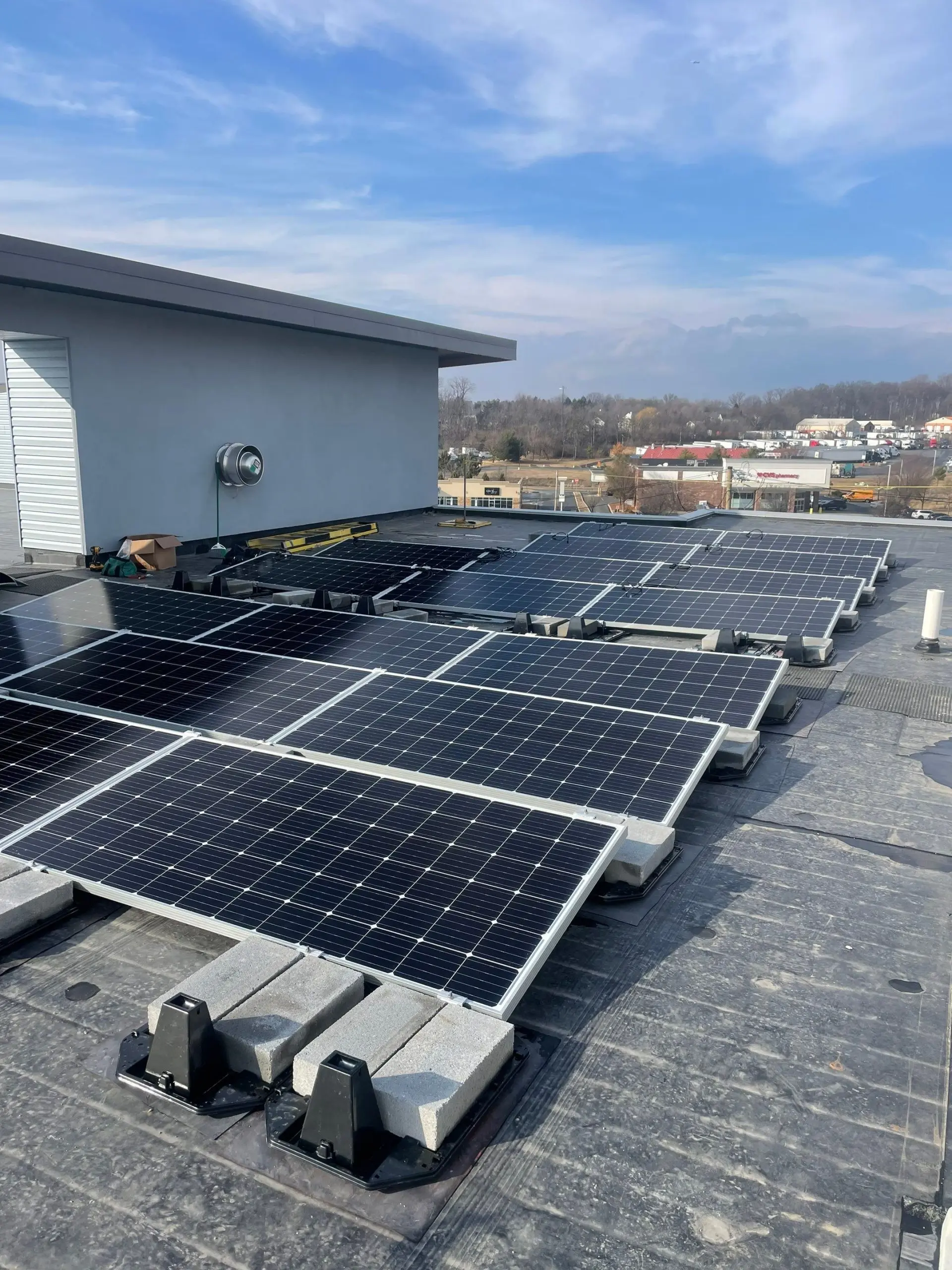 Ballasted solar panel array installed on a commercial flat roof