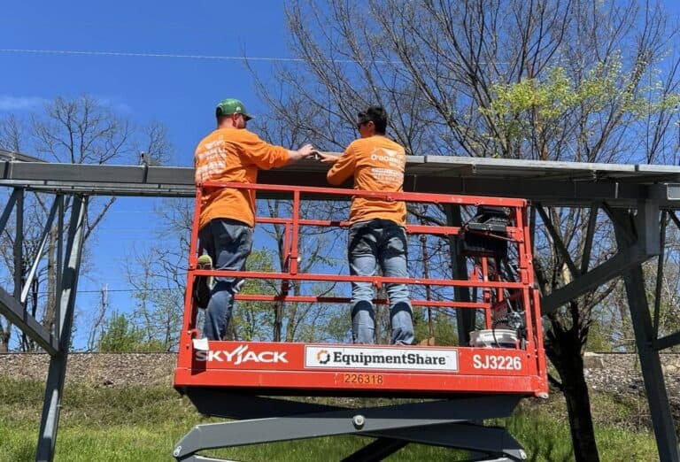 O'Donnell Solar team installing a large solar panel