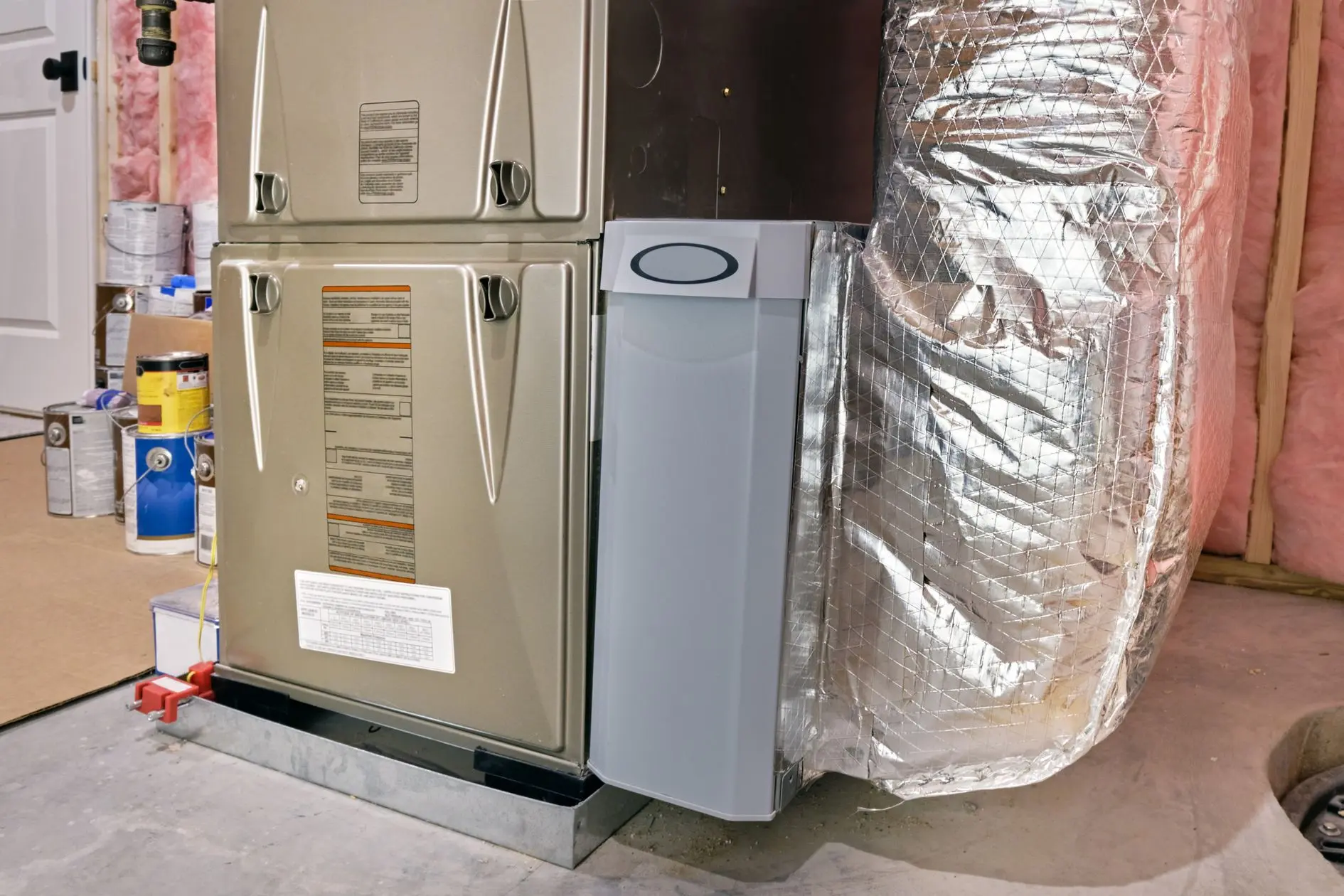 Furnace, air filter and ductwork in residential basement