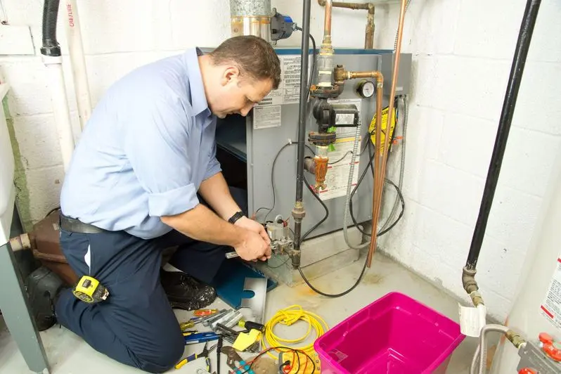 AC professional inspecting and repairing a furnace