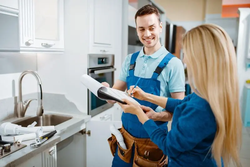 Plumber working with a happy client