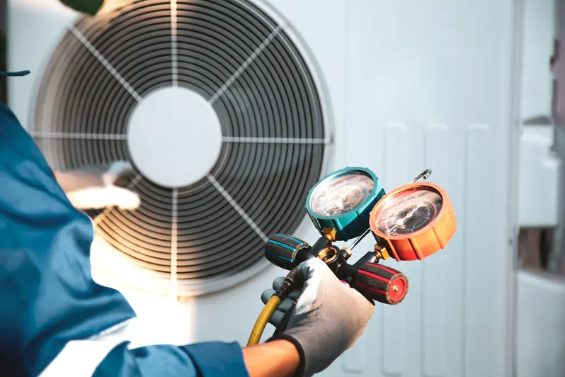 Professional from Christianson Air Conditioning & Plumbing checking a AC unit for fall
