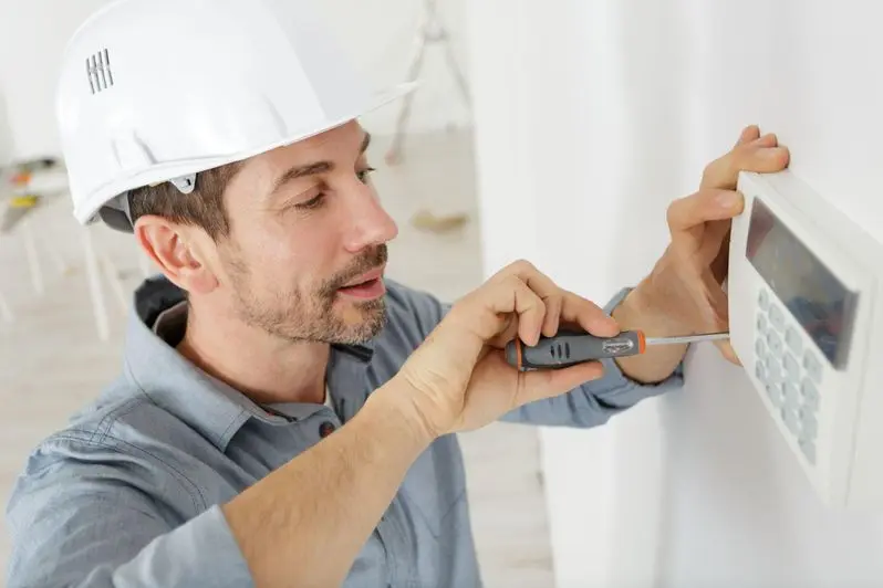 a happy plumber fixing thermostat