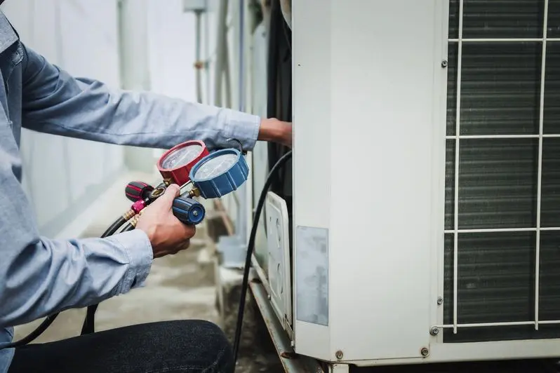 HVAC professional diagnosing an AC problem