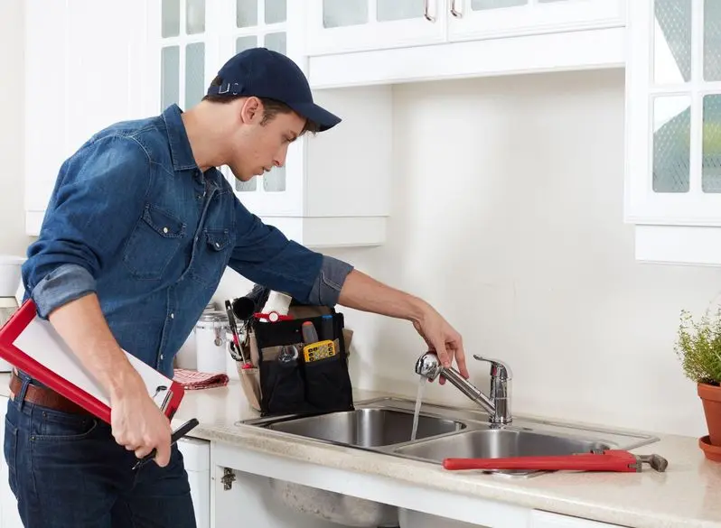 Professional plumber investigating a plumbing emergency