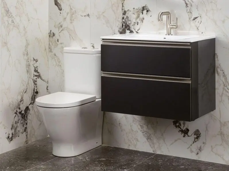 Interior of modern bathroom with toilet and sink