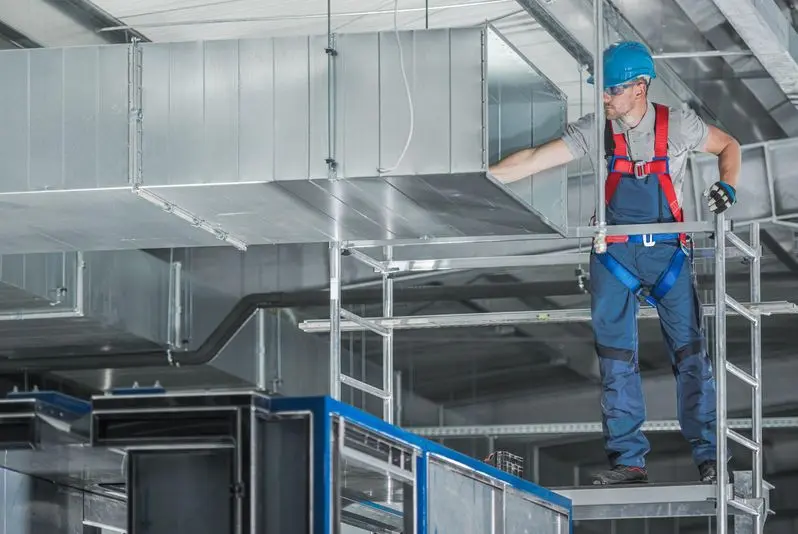 Hvac professional installing a commercial ac duct system