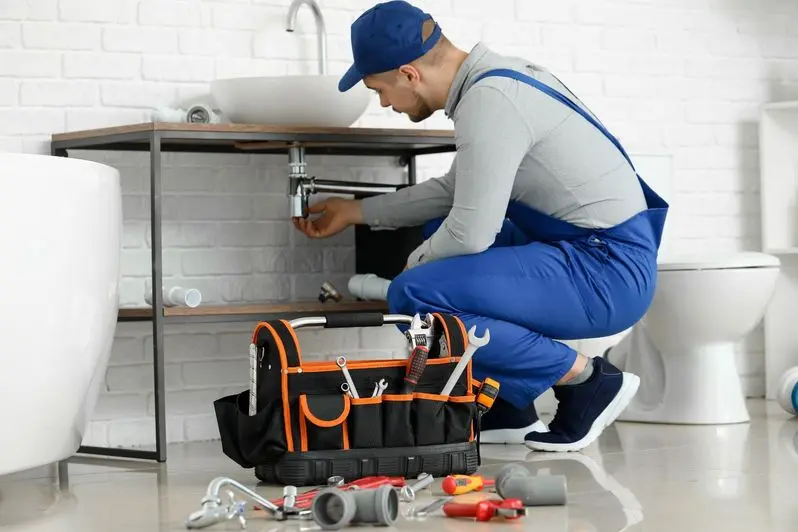 Plumber installing a low flow faucet
